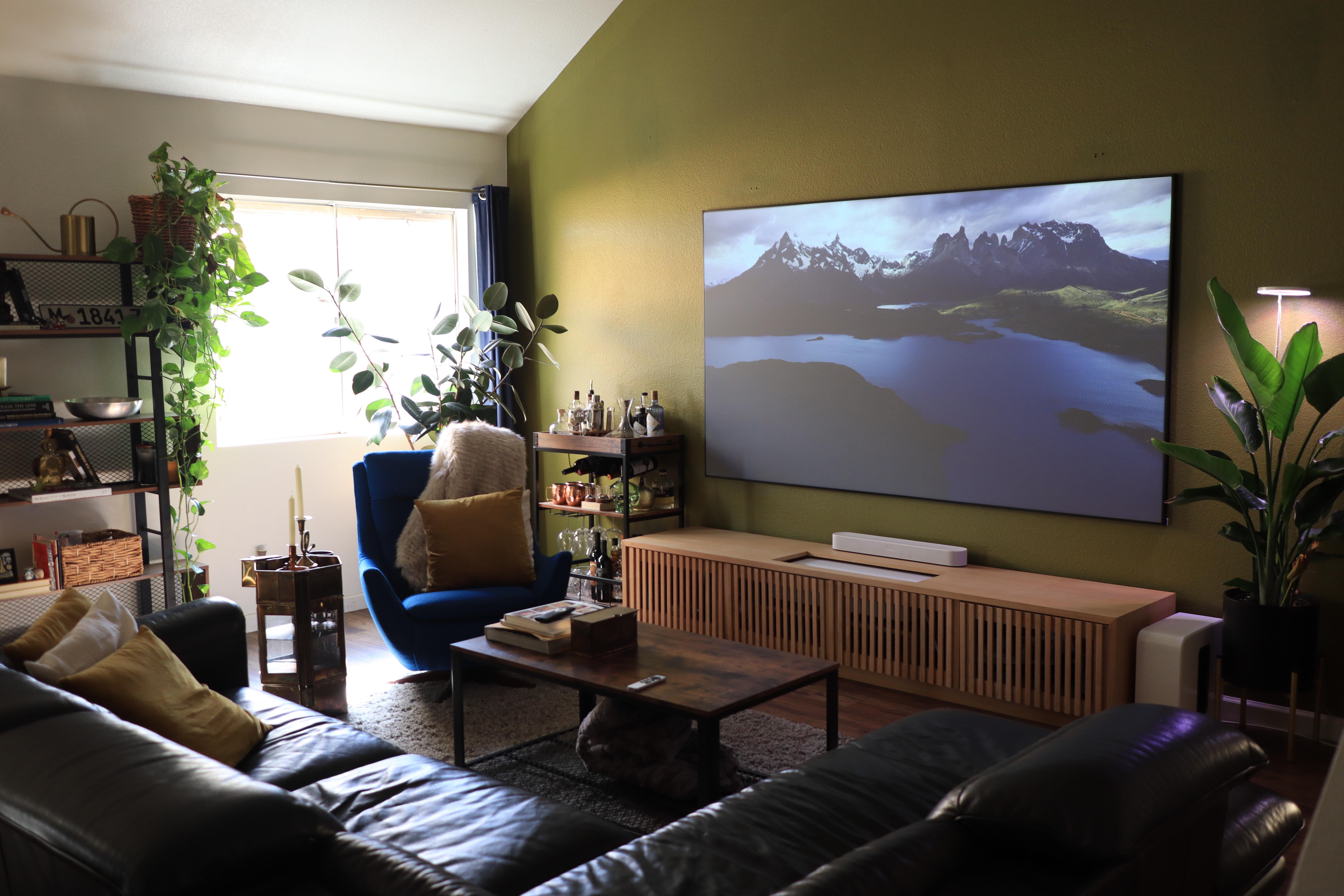 This design presents a sophisticated living space with a focus on audio quality and room acoustics. The discussion highlights the importance of investing in a quality sound system, with suggestions ranging from AV receivers to wireless speakers. Additionally, the conversation delves into the importance of room treatment for optimal audio control. The design also prioritizes aesthetics and convenience, with a Sonos surround system and hidden speaker wires. Overall, this living space showcases a balance between style and functionality. /2023_04_08_12fp7e5/2v5zssughosa1.jpg
