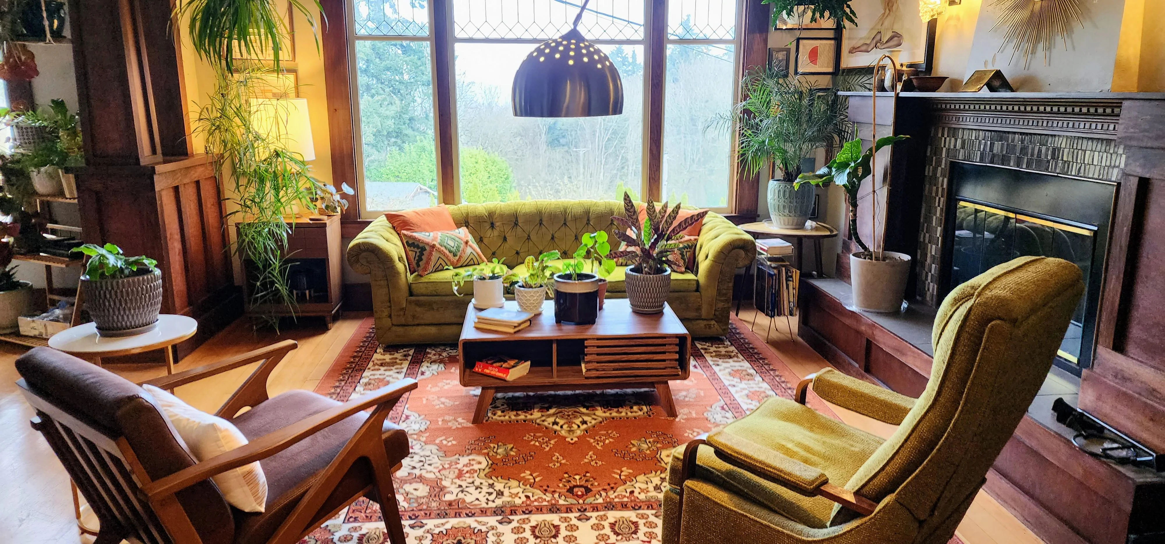 Living room with mix of dark woods and mid-century greens. /wood-and-greens-living-room/dmi38j97xbra1.webp